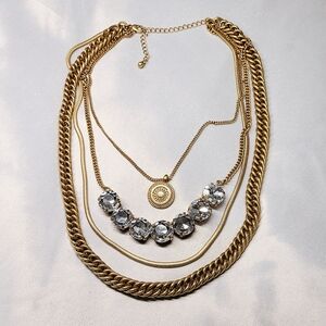 Gold Tone Multistrand Rope Necklace with Large Glass Rhinestones and Medallion